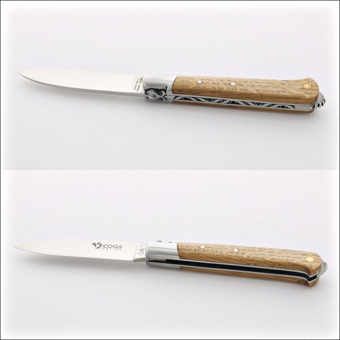 5 Coqs Pocket Knife, close-up of oak barrel wood handle with mother of pearl inlay. Handcrafted details, 100% Made in France.