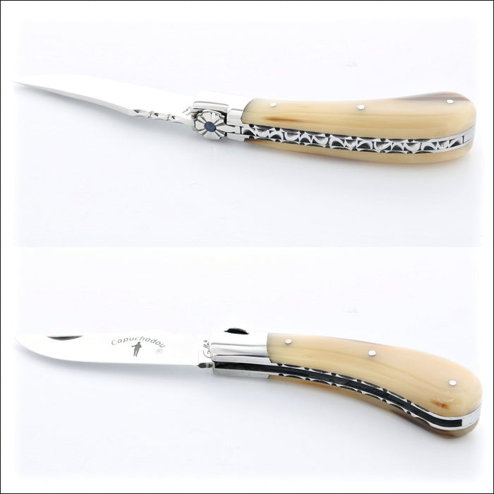 Capuchadou 10 cm Guilloche Folding Knife, side view of horn tip handle with ornate metalwork. Handcrafted details, 100% Made in France.