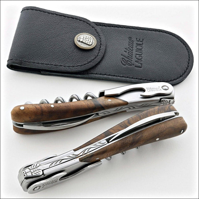 Chateau Laguiole Melchior Burled Walnut Handle, top-down view of two corkscrews and black leather case. Handcrafted details, 100% Made in France.