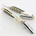 Chateau Laguiole Philippe Faure-Brac corkscrew, close-up of gold and black handle with "Faure-Brac" engraving. Handcrafted details, 100% Made in France.