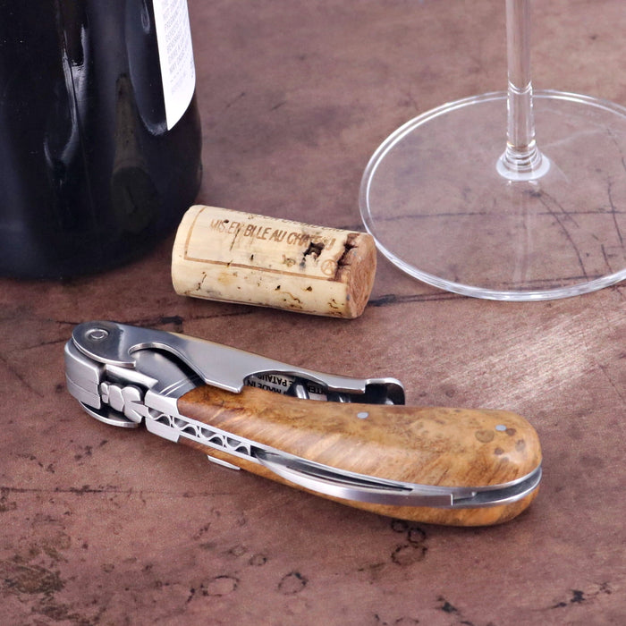 Laguiole Magnum Amboyna Burl Corkscrew, close-up of the elegant wood handle and polished steel.