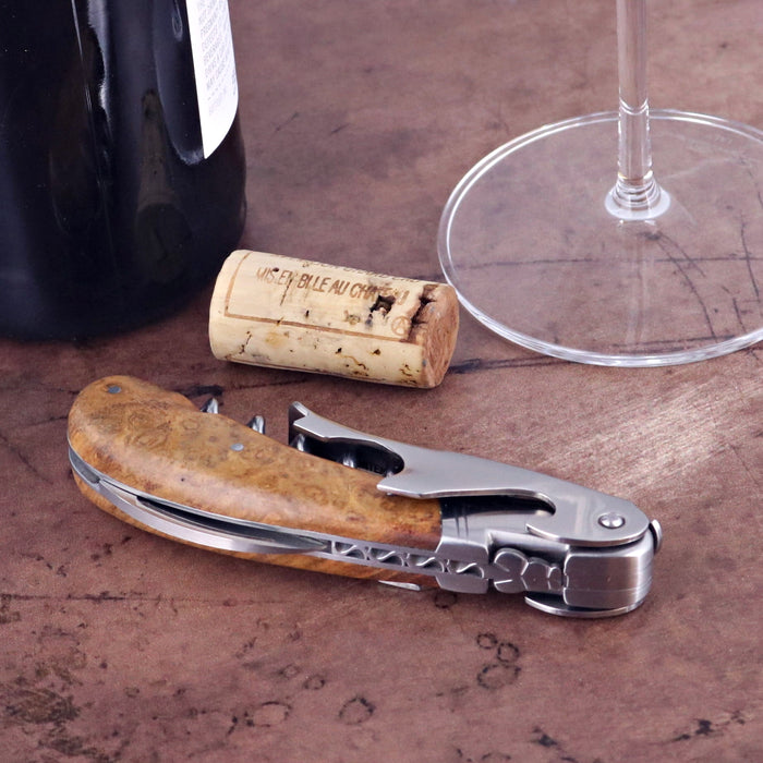 Laguiole Magnum Amboyna Burl Corkscrew, close-up of light brown burl handle and stainless steel.
