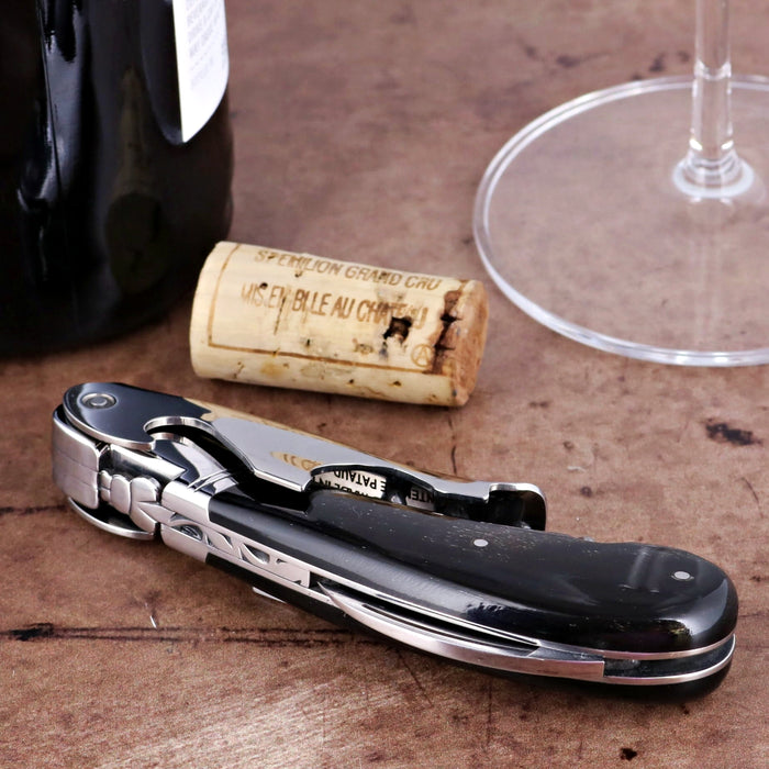 Laguiole Magnum Black Horn Tip Corkscrew, close-up of folded black handle with silver accents.