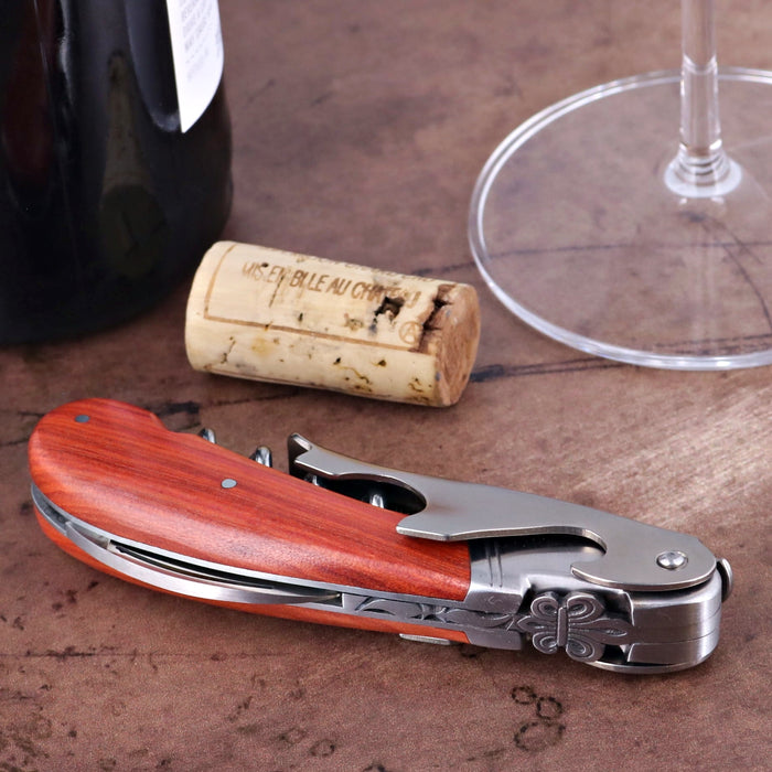 Laguiole Magnum Corkscrew Deco Fleur de Lys - Rosewood. Close-up of rosewood handle, silver accents, and Fleur de Lys design.