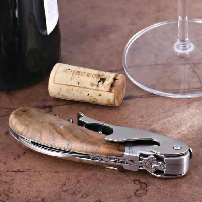 Laguiole Magnum Corkscrew Deco Freemason - Burled Walnut, close-up of the handle and silver mechanism.