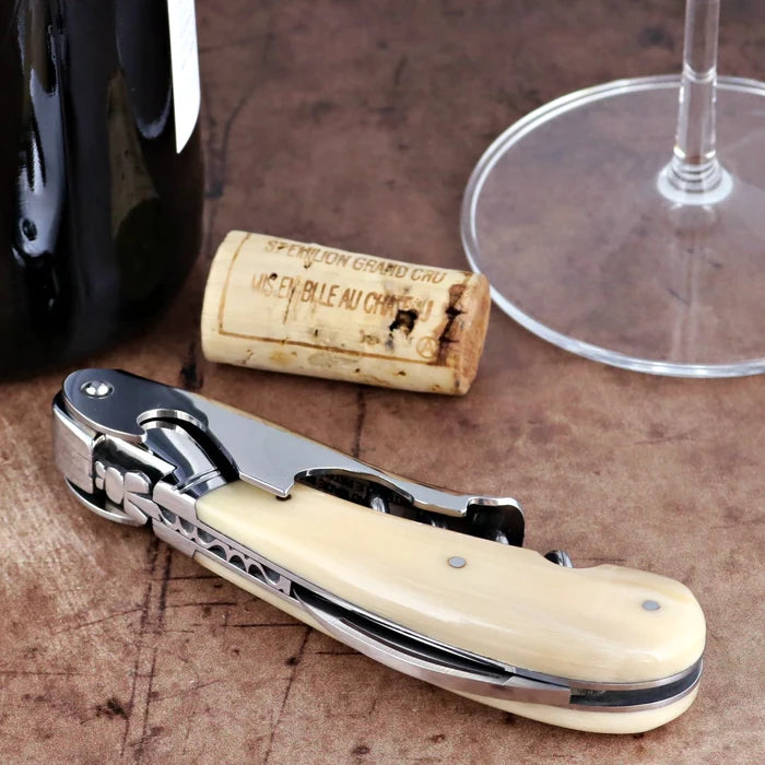 Laguiole Magnum Horn Tip Corkscrew close-up featuring a polished cream horn handle and steel frame.