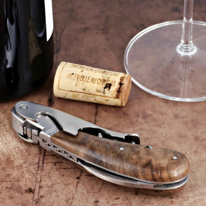 Laguiole Magnum Walnut Corkscrew close-up featuring a polished steel frame and rich walnut handle.