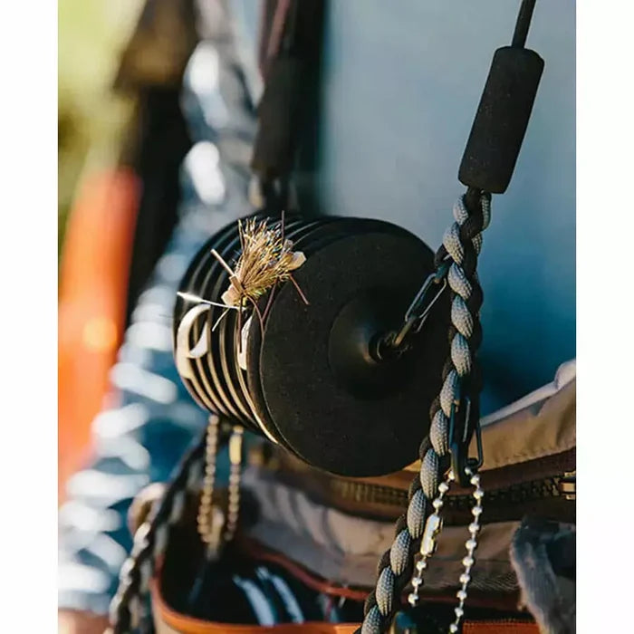 Loon Rigging Foams with dry fly pinned to black disc on paracord lanyard