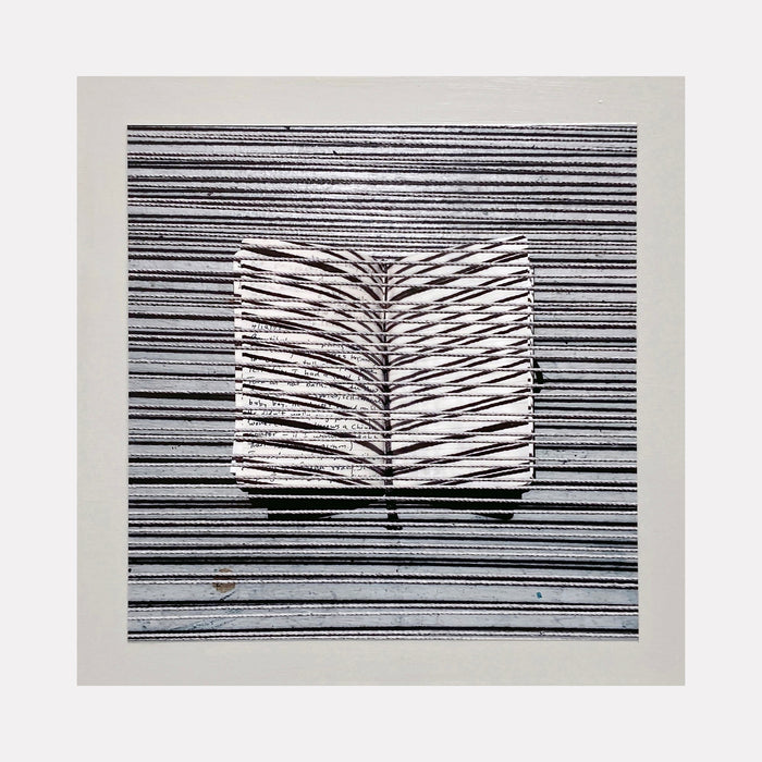 The artwork 'Sentence Structure String 6' by Anne Sherwood Pundyk features a striking black and white composition with parallel horizontal lines intersected by a central book-like form. The symmetrical pattern creates a dynamic visual rhythm, with crisp contrasting stripes against a light background. The archival inkjet print showcases precise linear detailing and textural depth.