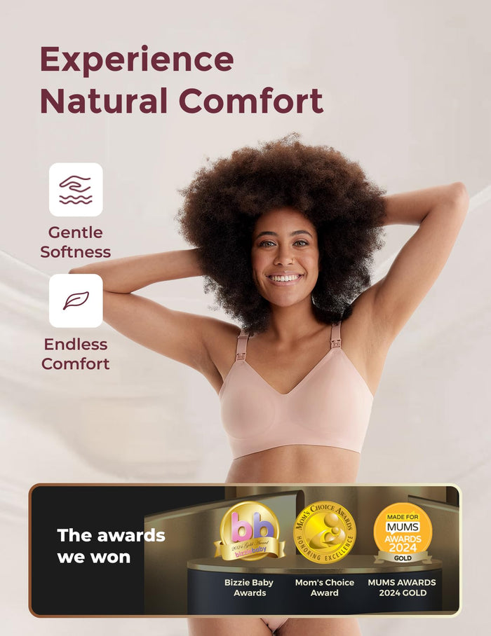 Smiling model in light nude Seamless Nursing Bra YN21. Highlights comfort, Bizzie Baby, Mom's Choice, Mums 2024 Gold awards.