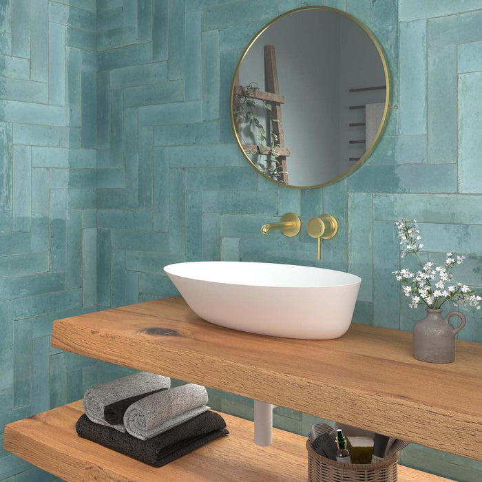Zellij Distressed Subway Tile Turquoise 2.8x11 featured on a bathroom wall